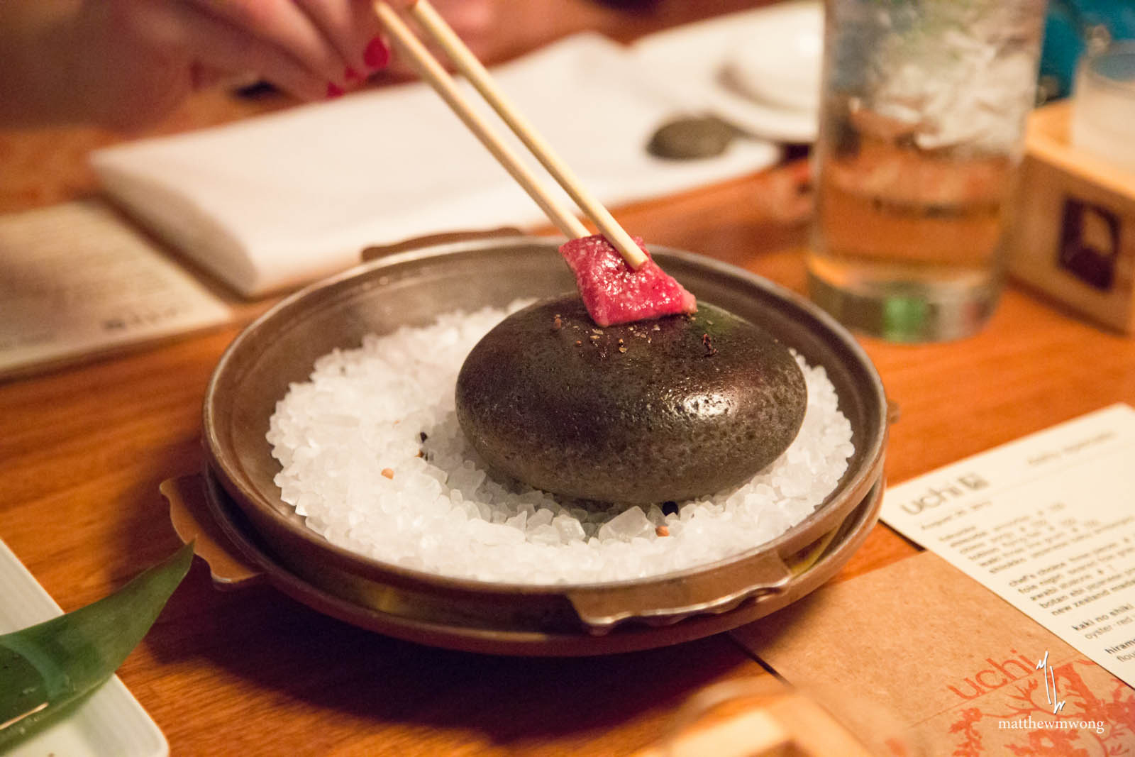 A bowl of rice and some meat on top of it